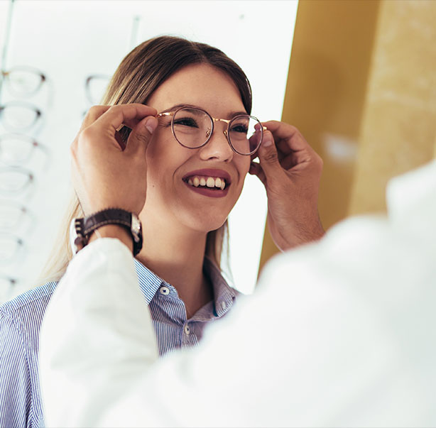 Trying on glasses in clinic