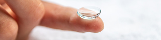 Holding a contact lens at the tip of the index finger